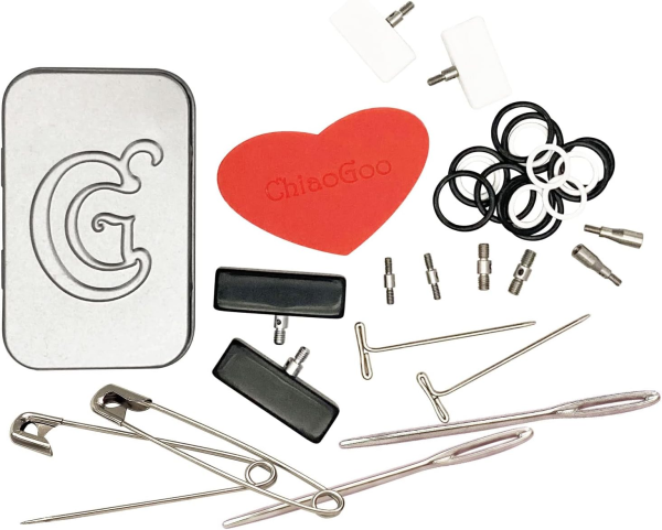 Collection of sewing needles, pins, and a red heart-shaped object with 'ChiaoGoo' branding on a white background.