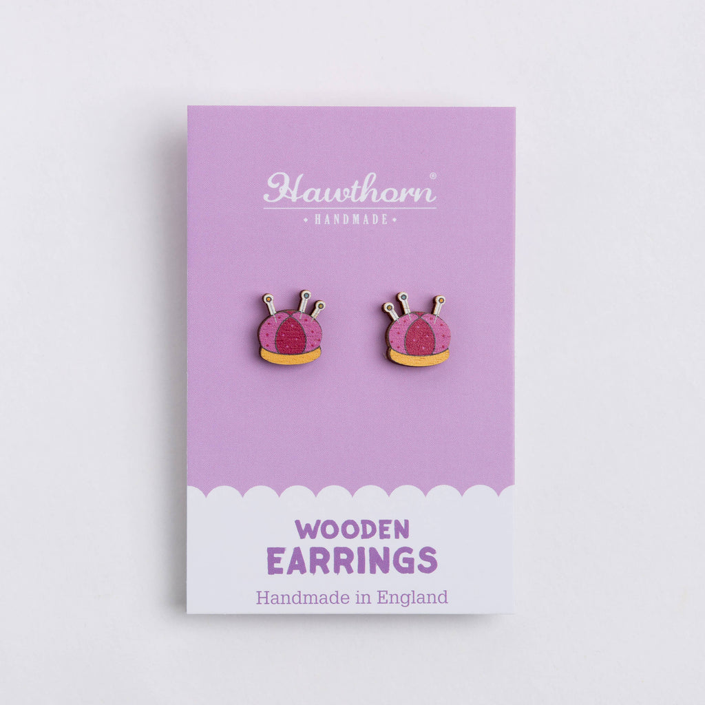 Wooden earrings on a purple card with 'Hawthorn Handmade' branding.