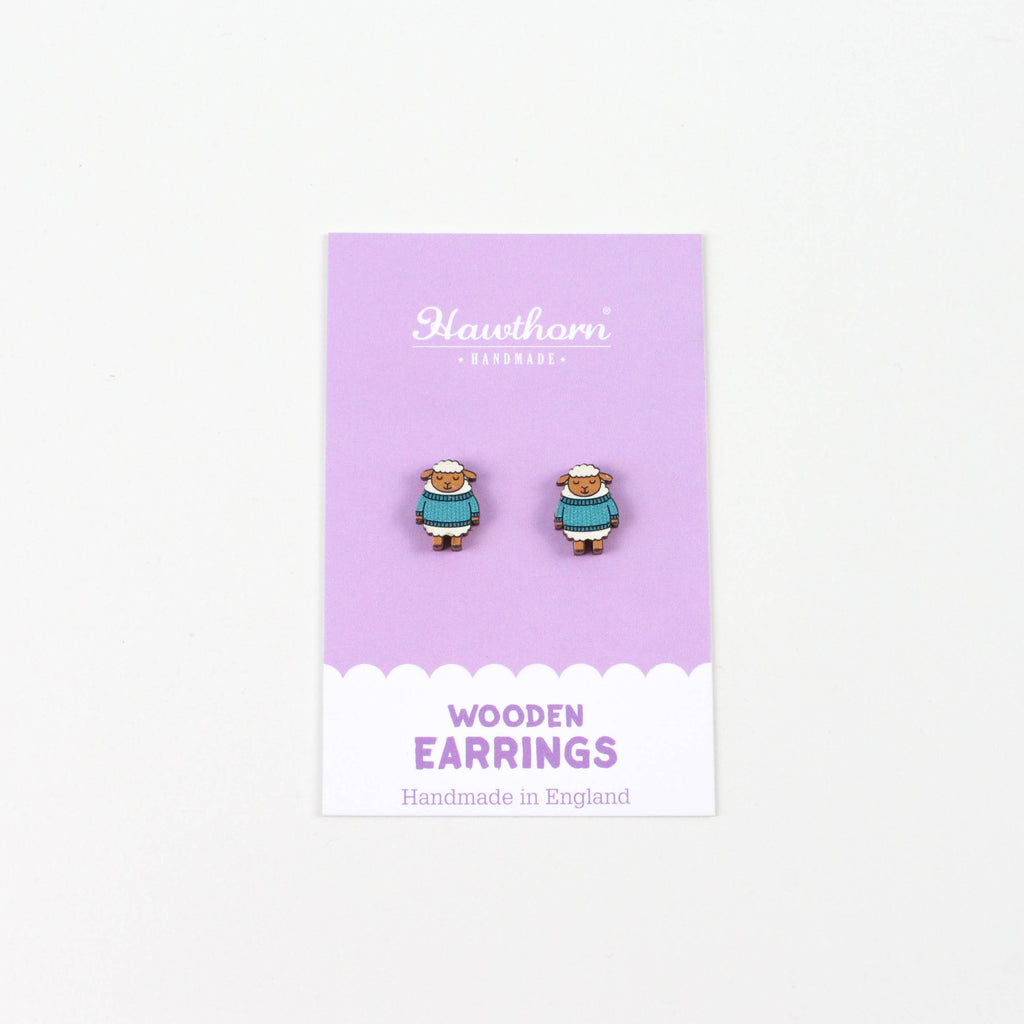 Wooden earrings on a purple card with 'Hawthorn' branding