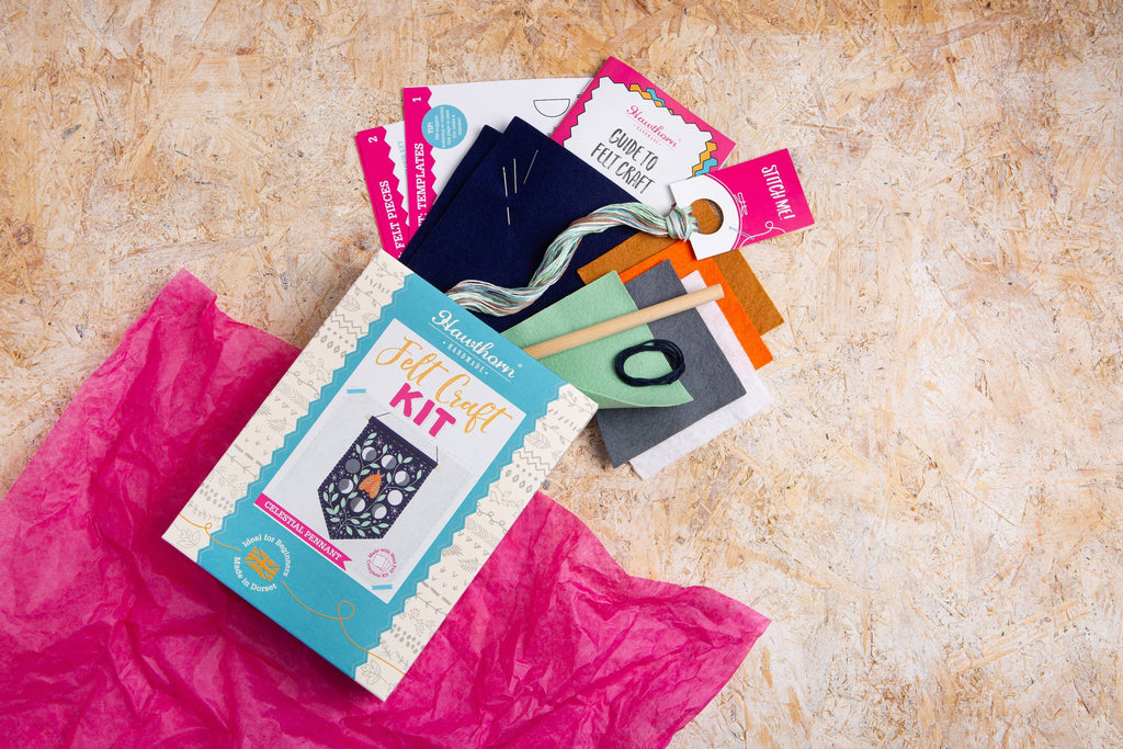 Craft kit with materials on a textured surface