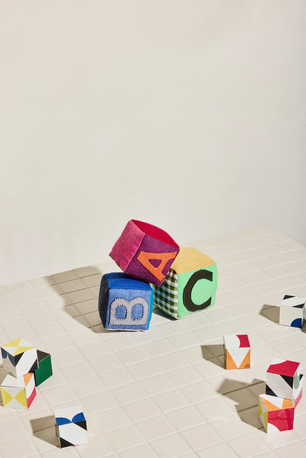 Colorful geometric blocks on a light surface
