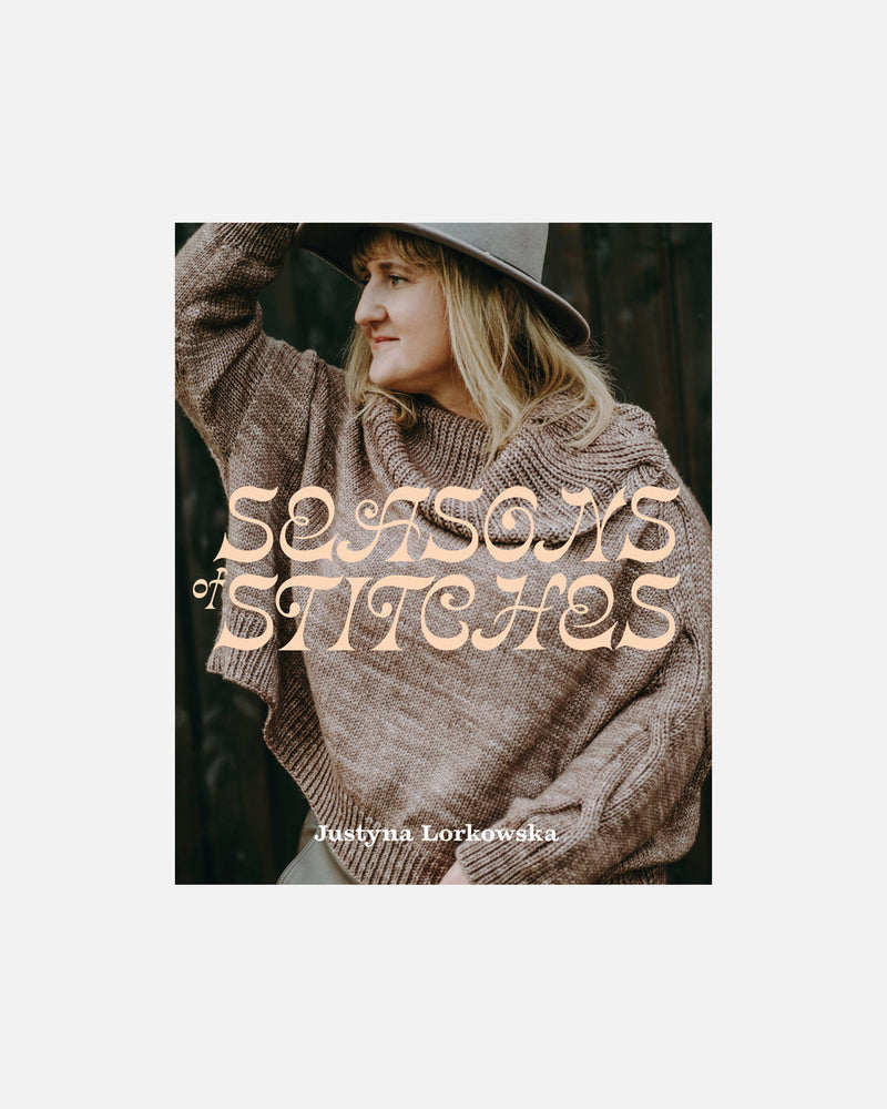 Book cover of 'Seasons & Stitches' with a person wearing a knitted sweater and hat.