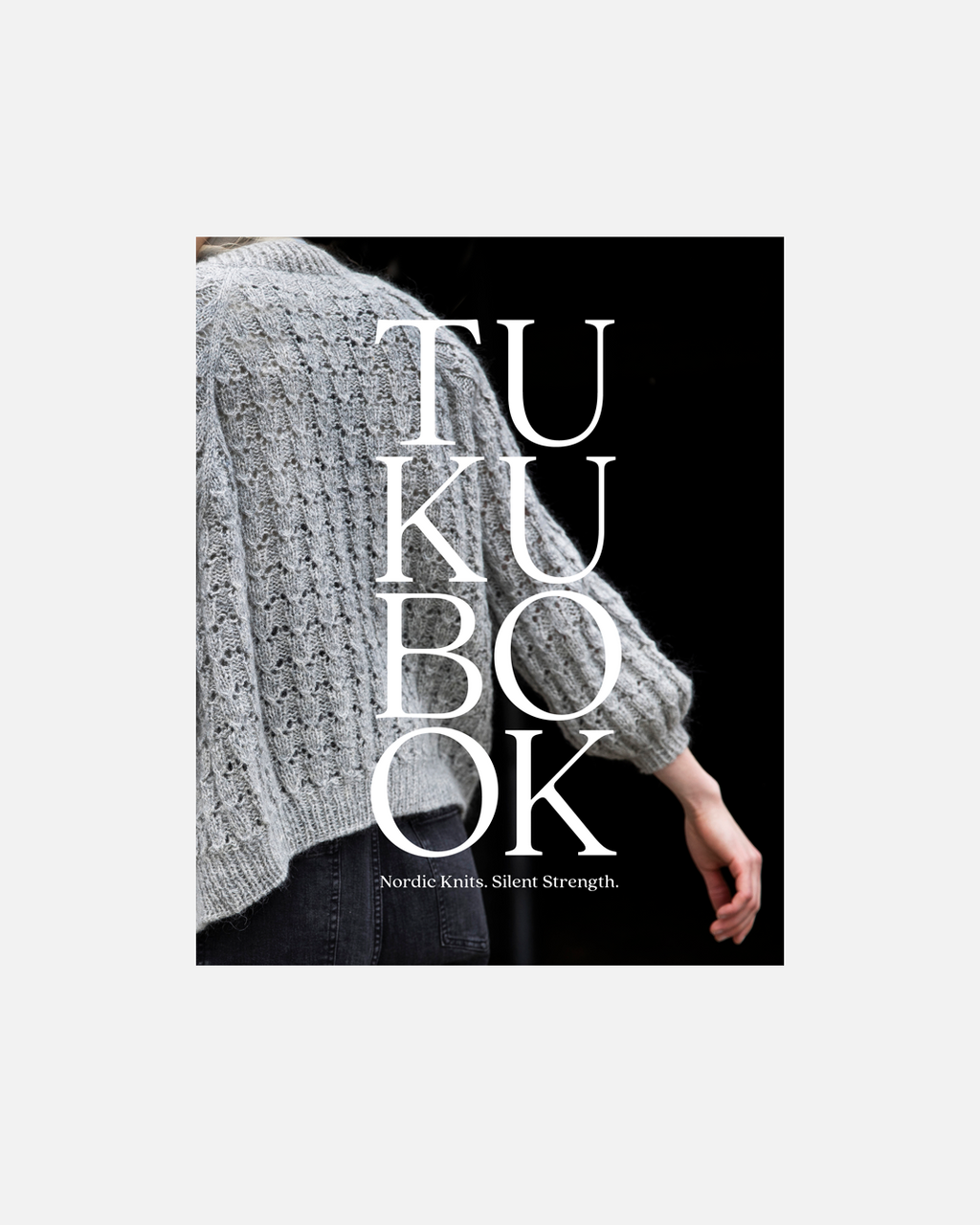 Book cover with text 'TUKU BOOK' and a person wearing a knitted sweater.