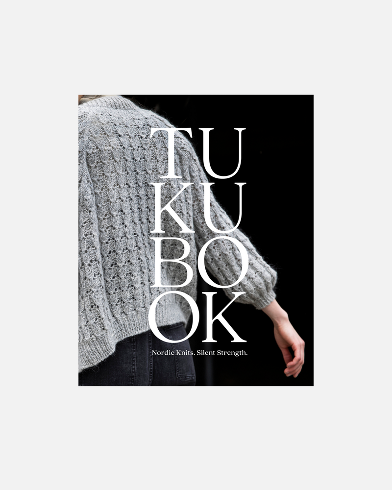 Book cover with text 'TUKU BOOK' and a person wearing a knitted sweater.